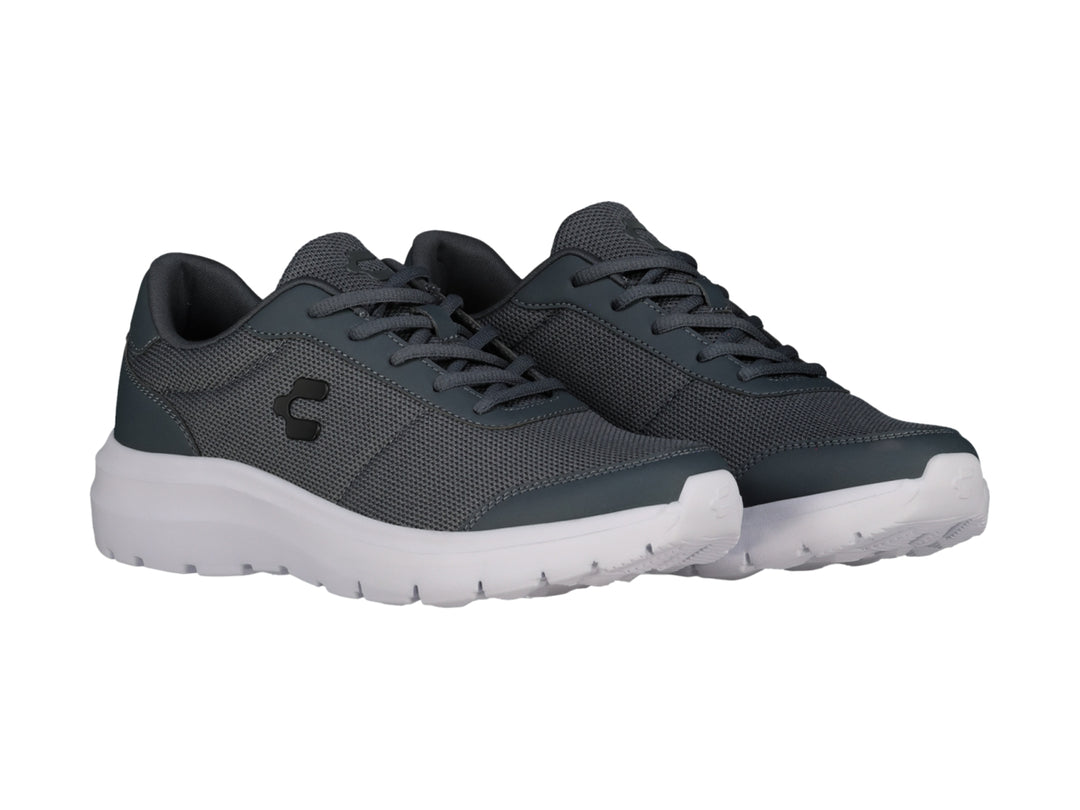 Tenis casuales Charly color gris con suela blanca y tejido de malla.