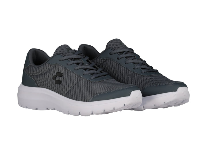 Tenis casuales Charly color gris con suela blanca y tejido de malla.