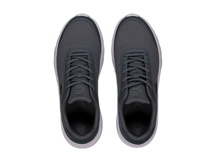 Tenis casuales Charly color gris con suela blanca y tejido de malla.