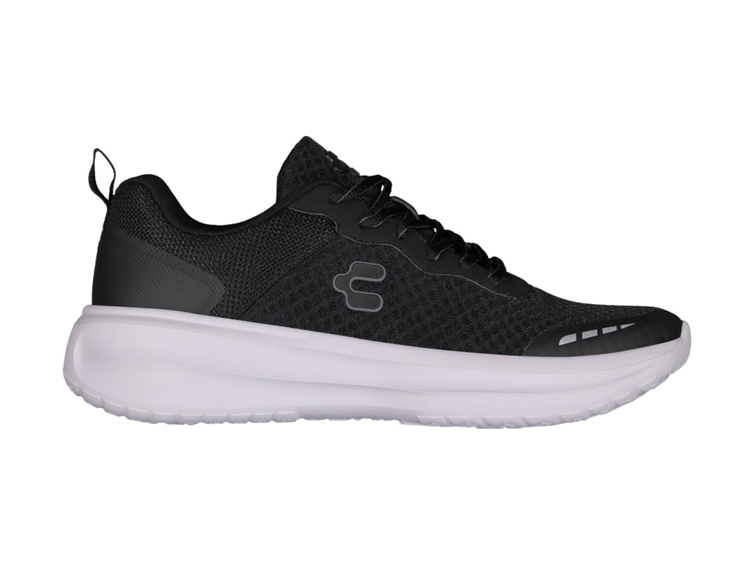 Tenis Charly Road Casual en color negro con suela blanca y tejido transpirable.