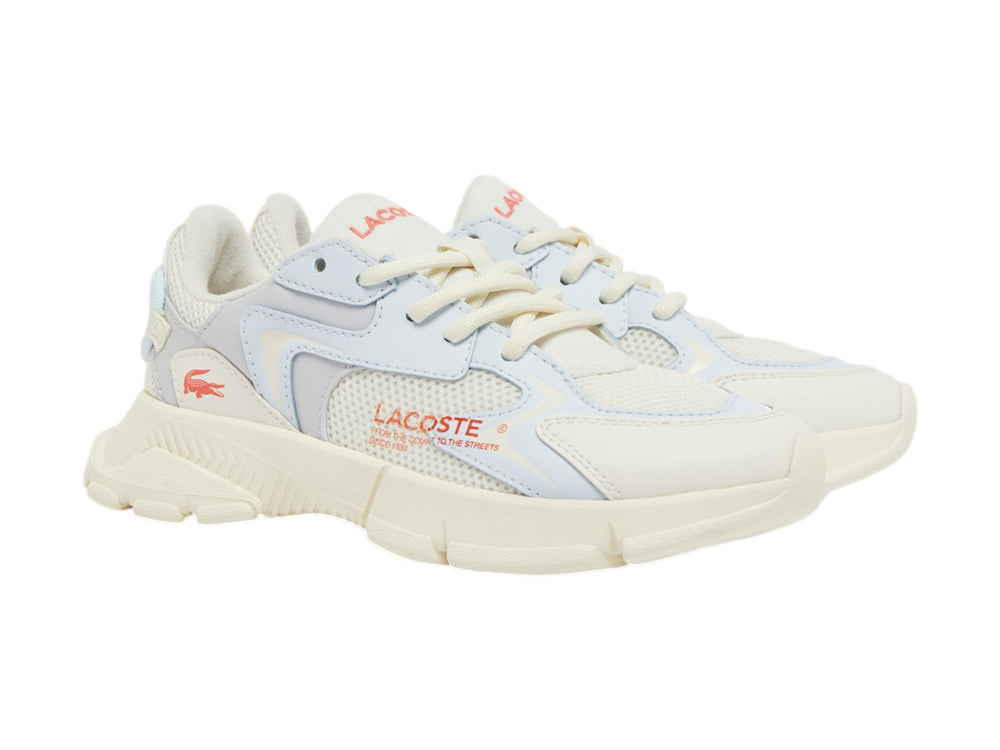 Tenis deportivos Lacoste en colores blanco roto y gris claro con suela gruesa y detalles en malla.