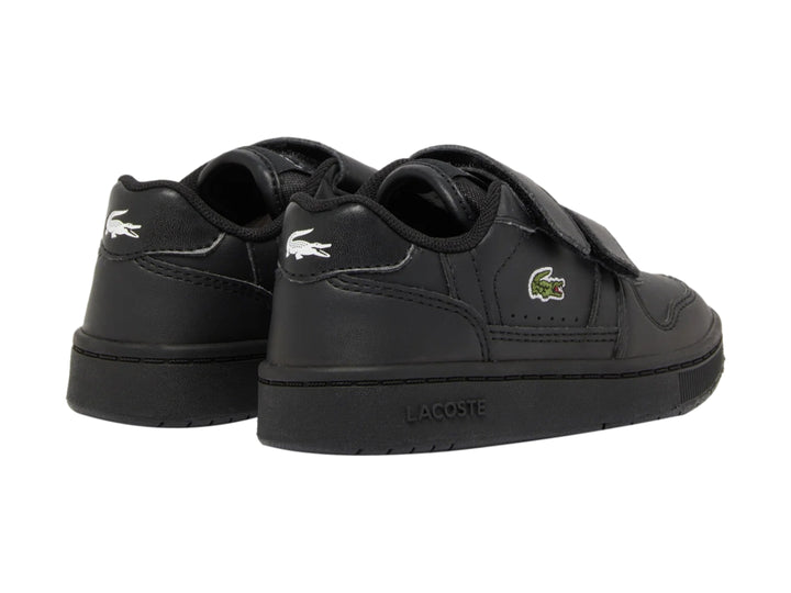 Tenis negros Lacoste para niño con cierre de velcro y suela negra.