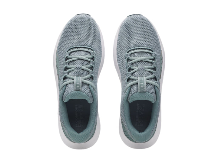 Tenis deportivos Under Armour color verde con suela blanca, vista lateral.