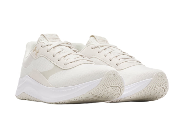 Tenis deportivos Under Armour color blanco con suela blanca y diseño minimalista.