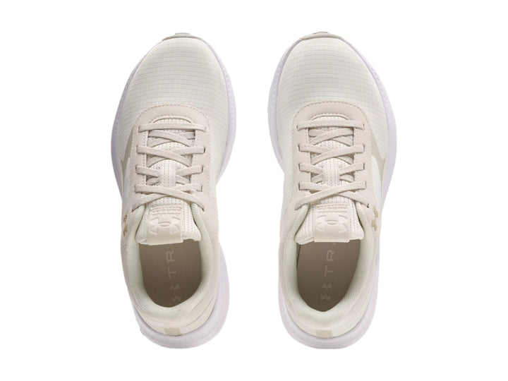 Tenis deportivos Under Armour color blanco con suela blanca y diseño minimalista.