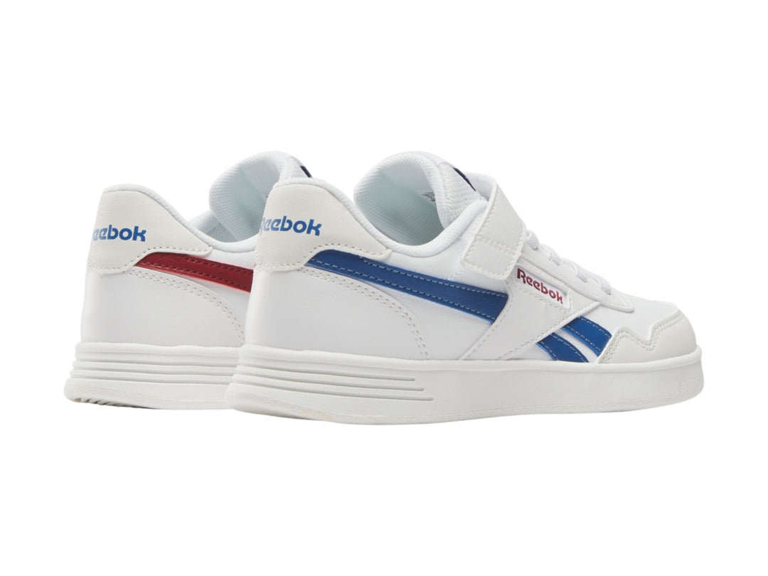 Tenis Reebok blancos con detalles en azul, cierre de velcro y agujetas.