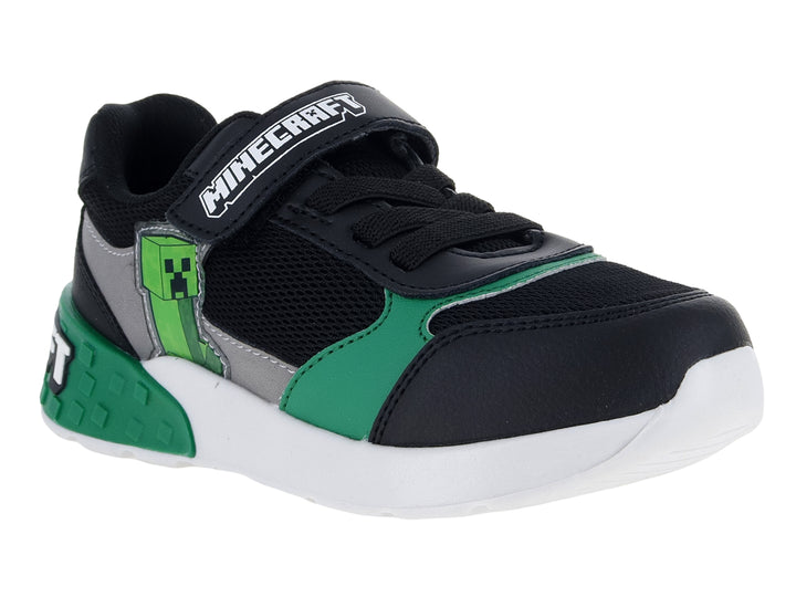 Tenis deportivos para niño color negro y verde con temática de Minecraft y suela blanca.