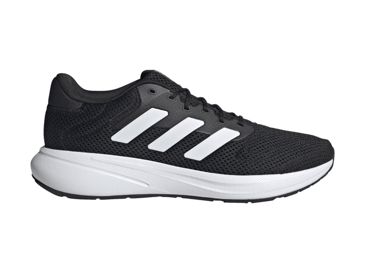 Tenis deportivos Adidas color negro con franjas y suela blanca.