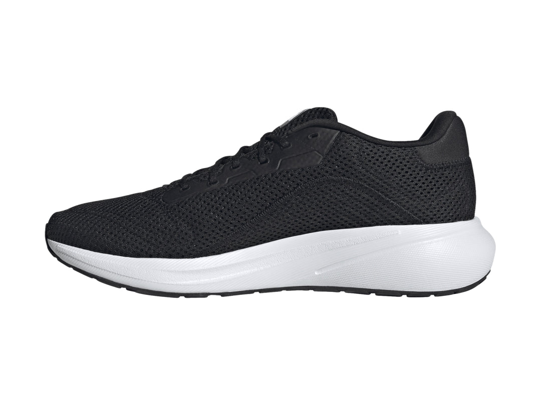 Tenis deportivos Adidas color negro con franjas y suela blanca.