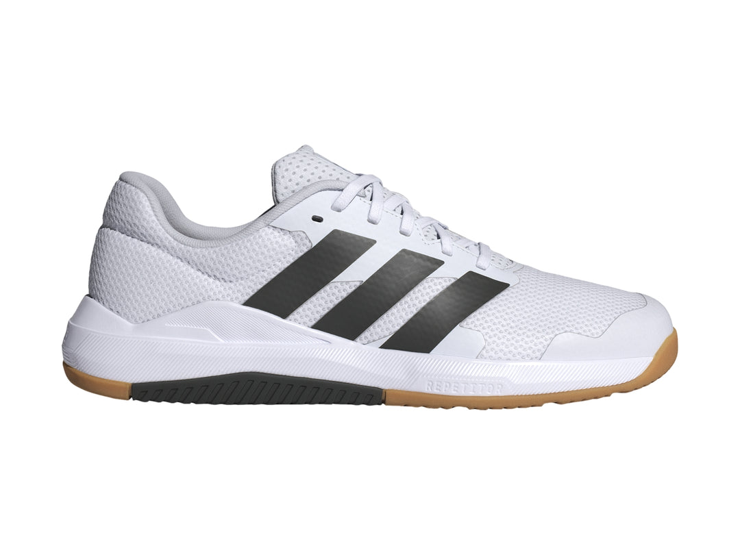 Tenis deportivos Adidas DropSet Base color blanco con franjas negras y suela de goma color café.