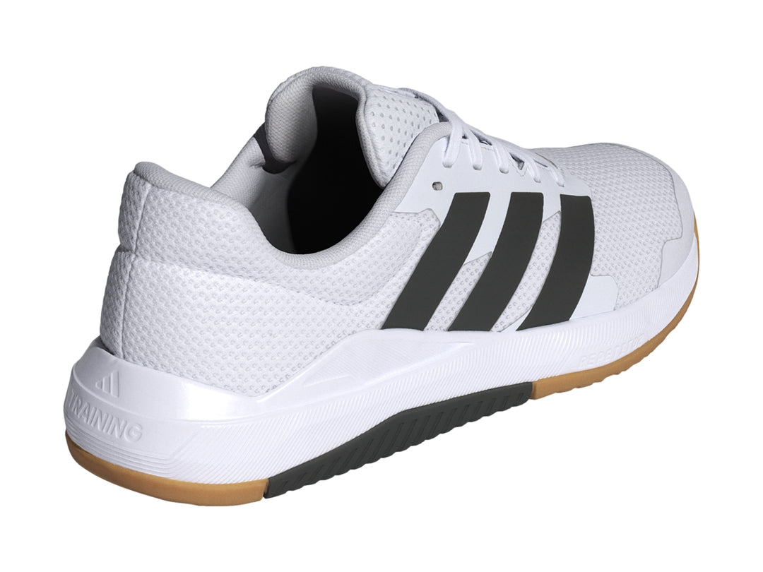 Tenis deportivos Adidas DropSet Base color blanco con franjas negras y suela de goma color café.