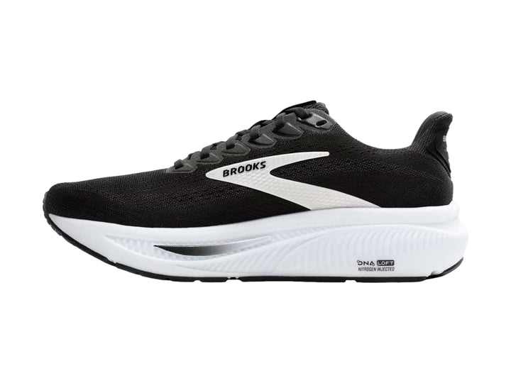 Tenis deportivos Brooks Ghost 17 color negro con suela blanca y detalles laterales blancos.