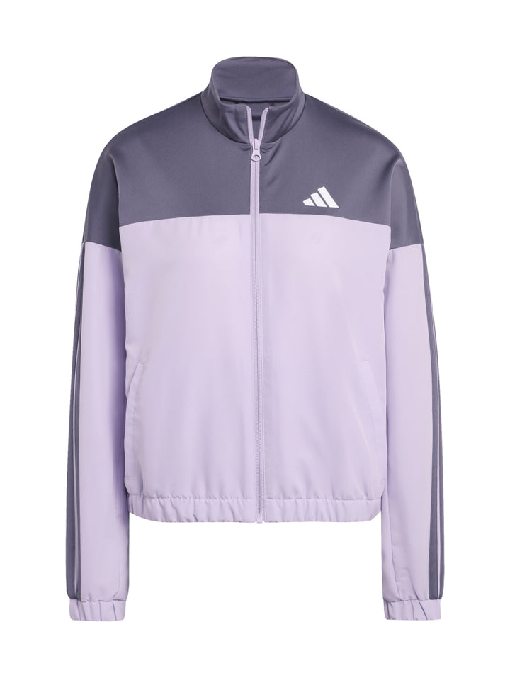Conjunto deportivo Adidas Bold Block en color lila y gris, compuesto por chaqueta y pantalón para mujer.