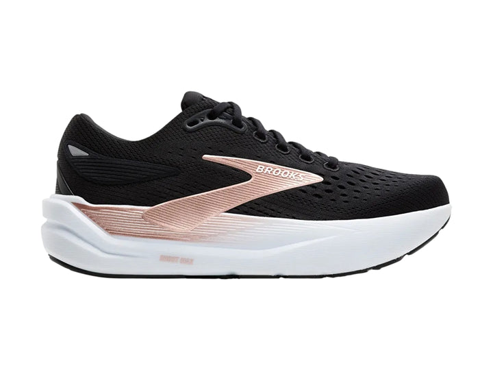 Tenis deportivos Brooks Ghost Max 3 color negro con suela blanca y detalles en oro rosa.