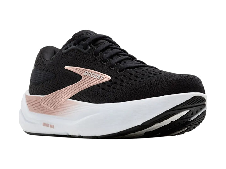 Tenis deportivos Brooks Ghost Max 3 color negro con suela blanca y detalles en oro rosa.