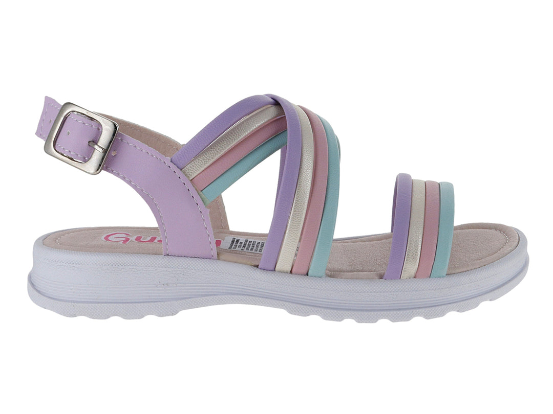 Sandalia infantil multicolor con tiras en lila, plata y azul claro y suela blanca.