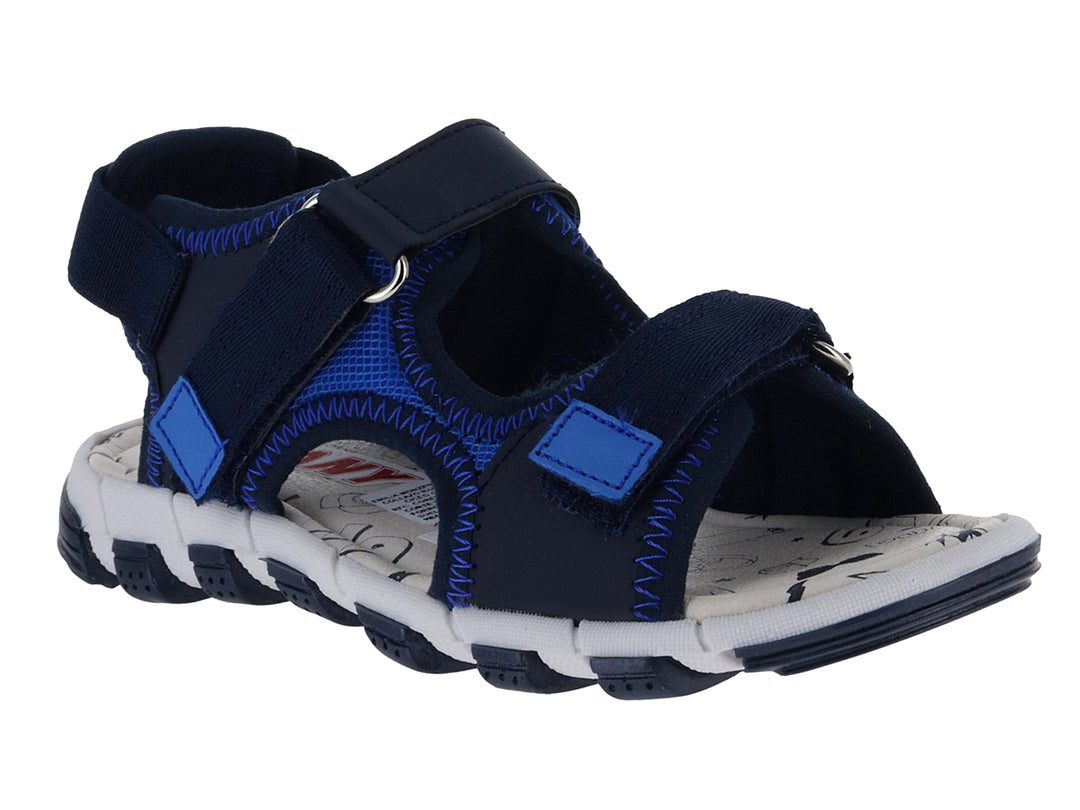 Sandalia deportiva para niño en color azul marino y blanco con correas de velcro y suela blanca.