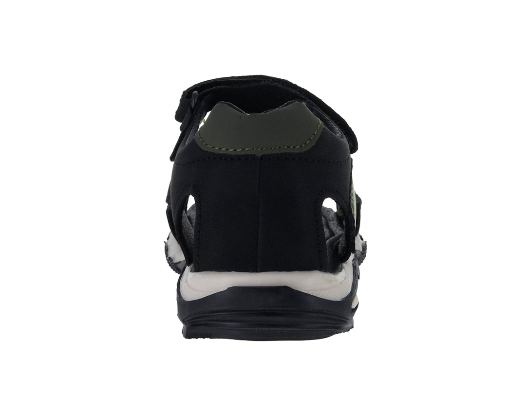 Sandalia infantil color negro con detalles verdes, dibujo de dinosaurio y suela blanca.