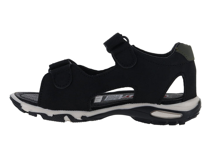 Sandalia infantil color negro con detalles verdes, dibujo de dinosaurio y suela blanca.