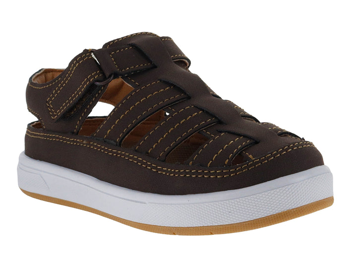 Sandalia cerrada color chocolate con suela blanca y correa ajustable.