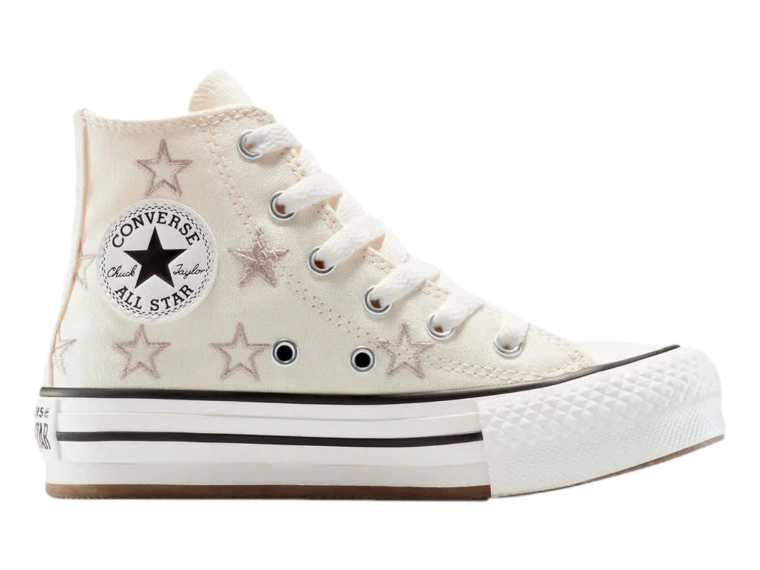 Tenis Converse Chuck Taylor All Star de bota color hueso con estrellas y suela de plataforma blanca.