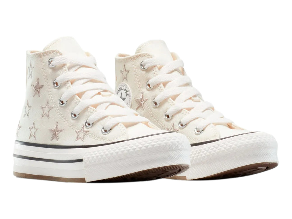 Tenis Converse Chuck Taylor All Star de bota color hueso con estrellas y suela de plataforma blanca.