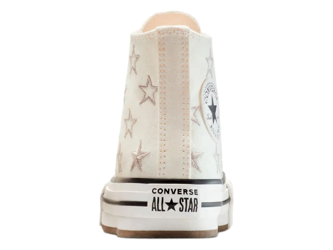 Tenis Converse Chuck Taylor All Star de bota color hueso con estrellas y suela de plataforma blanca.