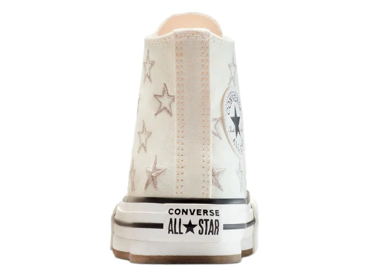 Tenis Converse Chuck Taylor All Star de bota color hueso con estrellas y suela de plataforma blanca.
