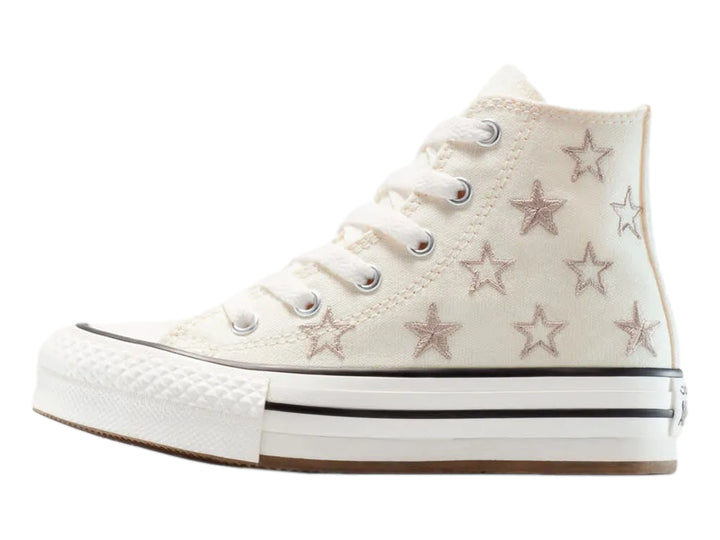 Tenis Converse Chuck Taylor All Star de bota color hueso con estrellas y suela de plataforma blanca.