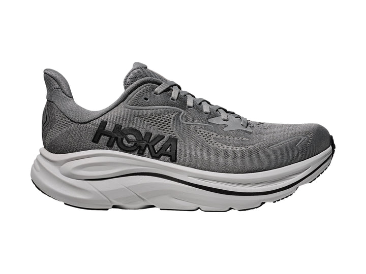 Tenis HOKA Clifton 10 en color gris galáctico con suela blanca gruesa para running.