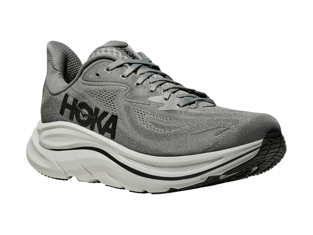Tenis HOKA Clifton 10 en color gris galáctico con suela blanca gruesa para running.