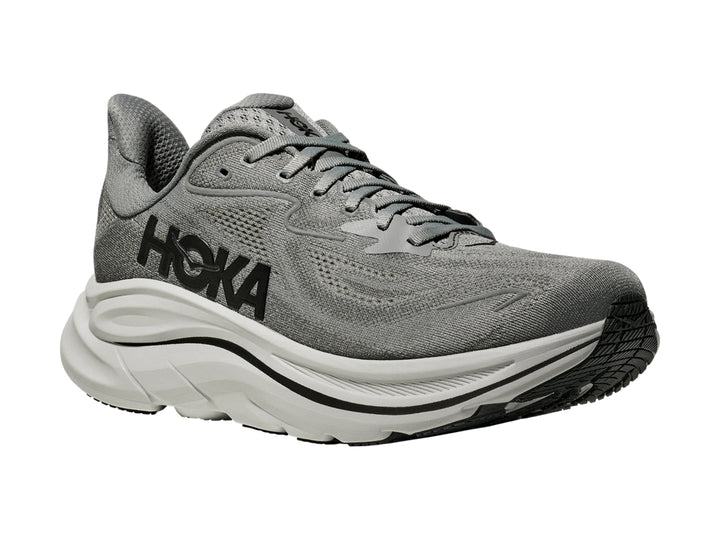 Tenis HOKA Clifton 10 en color gris galáctico con suela blanca gruesa para running.