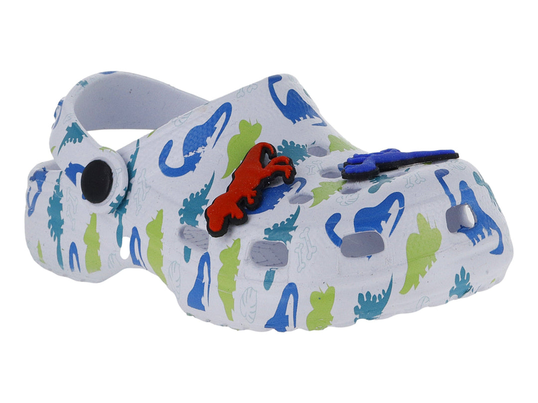 Zuecos blancos para niño con estampado de dinosaurios en azul y verde, incluyendo figuras decorativas en relieve.