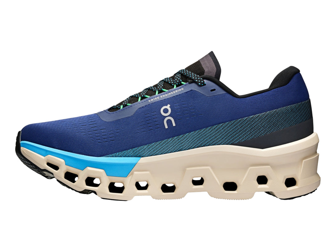 Tenis deportivos On Cloud en color azul con suela beige y detalles en celeste, vista lateral.