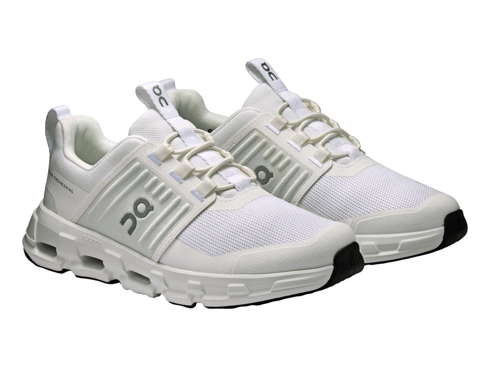 Tenis deportivos blancos para Niño marca On Cloud con suela amortiguada y malla transpirable.
