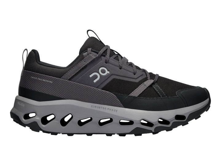 Tenis deportivos On Cloud en color negro y gris con suela amortiguada característica.