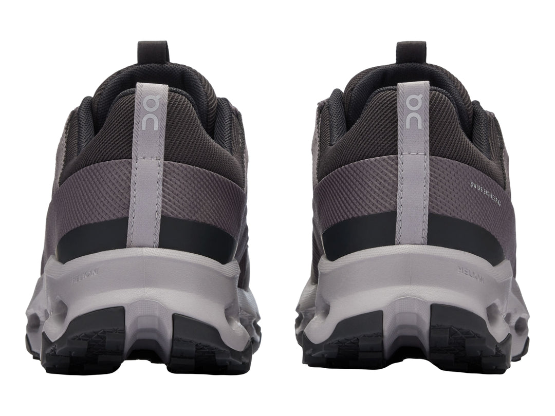 Tenis deportivos On Cloud en color negro y gris con suela amortiguada característica.