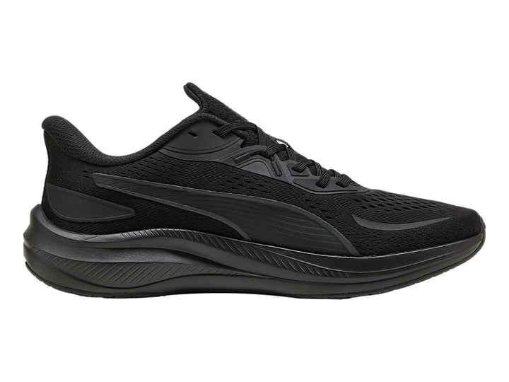 Tenis deportivos PUMA color negro con suela gruesa y parte superior de malla.
