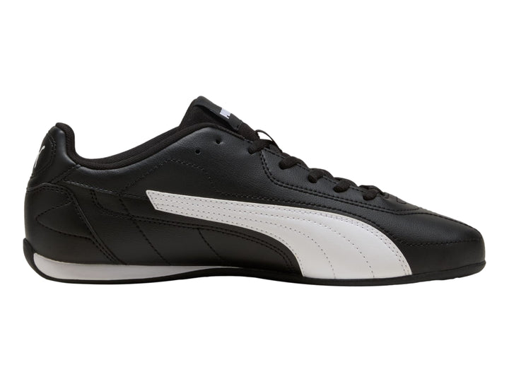 Tenis PUMA Catch en color negro con franja lateral blanca y suela blanca, vista de perfil.