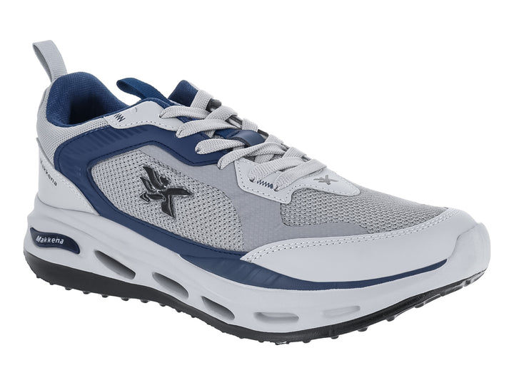 Tenis deportivos Makkena en colores gris, blanco y azul marino con suela blanca y detalles en malla.