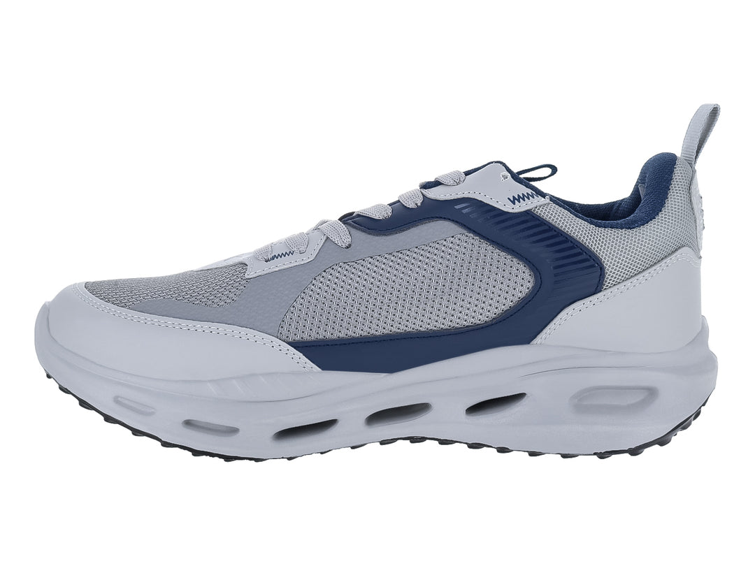 Tenis deportivos Makkena en colores gris, blanco y azul marino con suela blanca y detalles en malla.