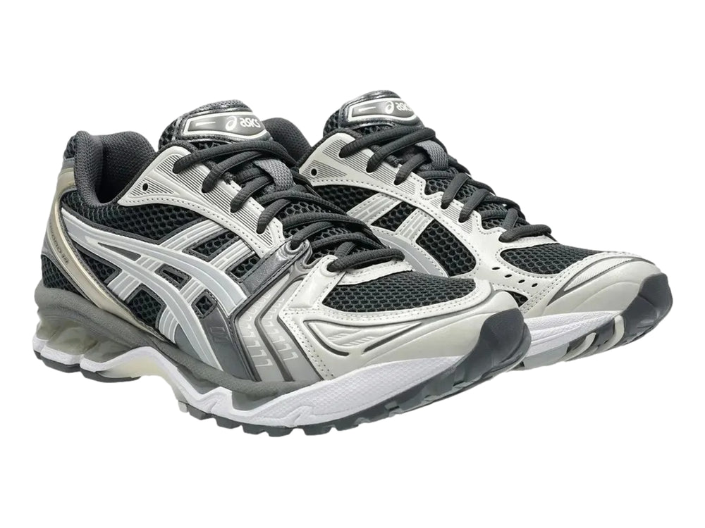 Tenis deportivos ASICS Gel-Kayano 14 en colores gris, blanco y negro con suela amortiguada.