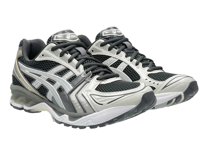 Tenis deportivos ASICS Gel-Kayano 14 en colores gris, blanco y negro con suela amortiguada.