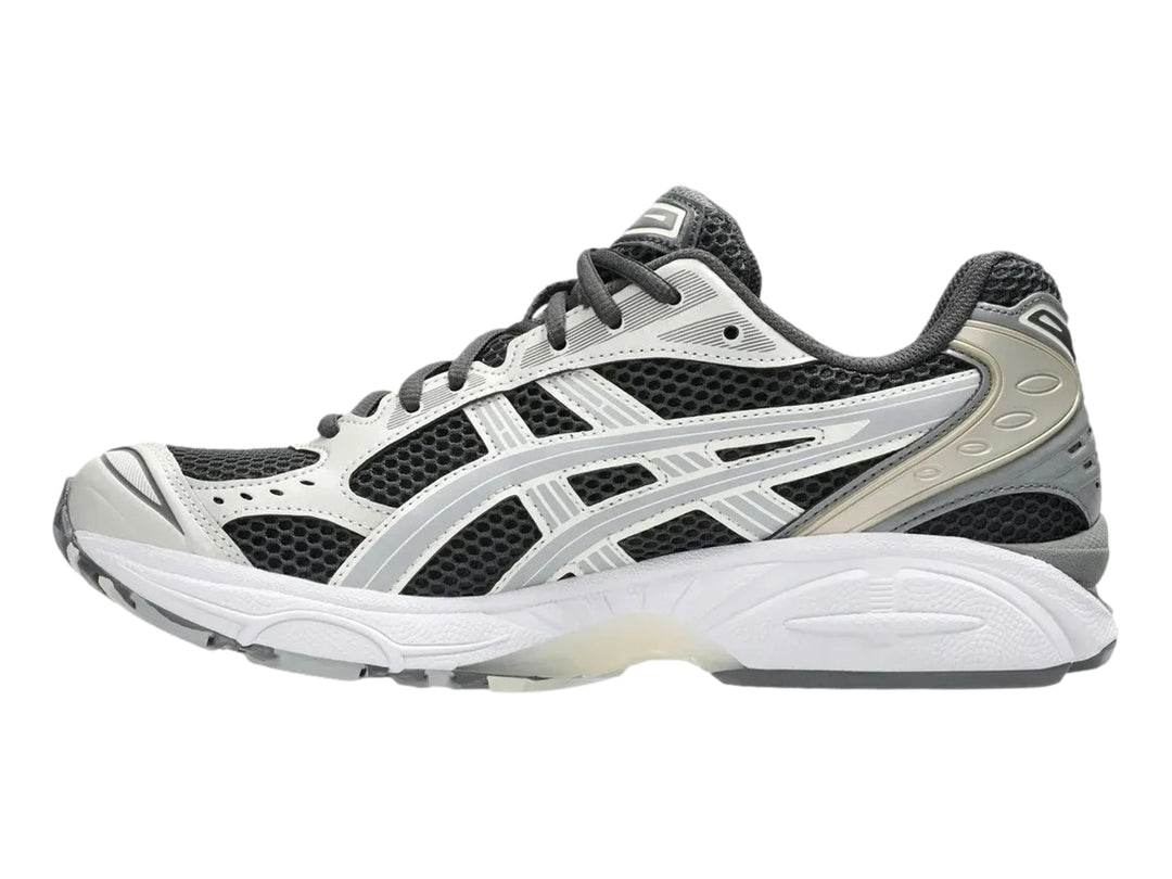 Tenis deportivos ASICS Gel-Kayano 14 en colores gris, blanco y negro con suela amortiguada.