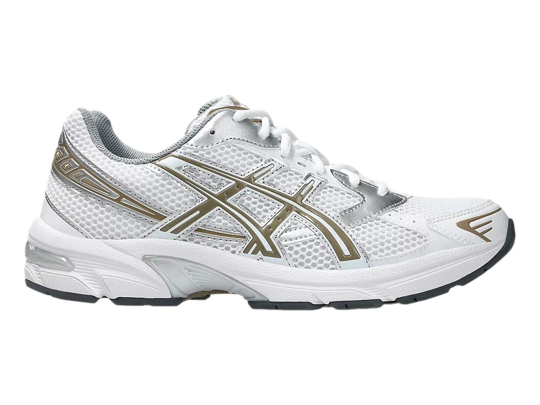 Tenis deportivos ASICS GEL-1130 en color blanco con detalles dorados y grises, vista lateral.