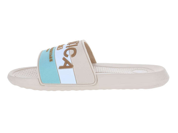Sandalia deslizable Nautica color arena con franja azul y blanca en la correa.