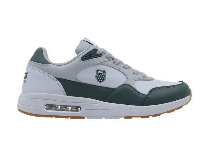 Tenis K-Swiss Maxwell en colores blanco, gris y verde con suela marrón y amortiguación visible.