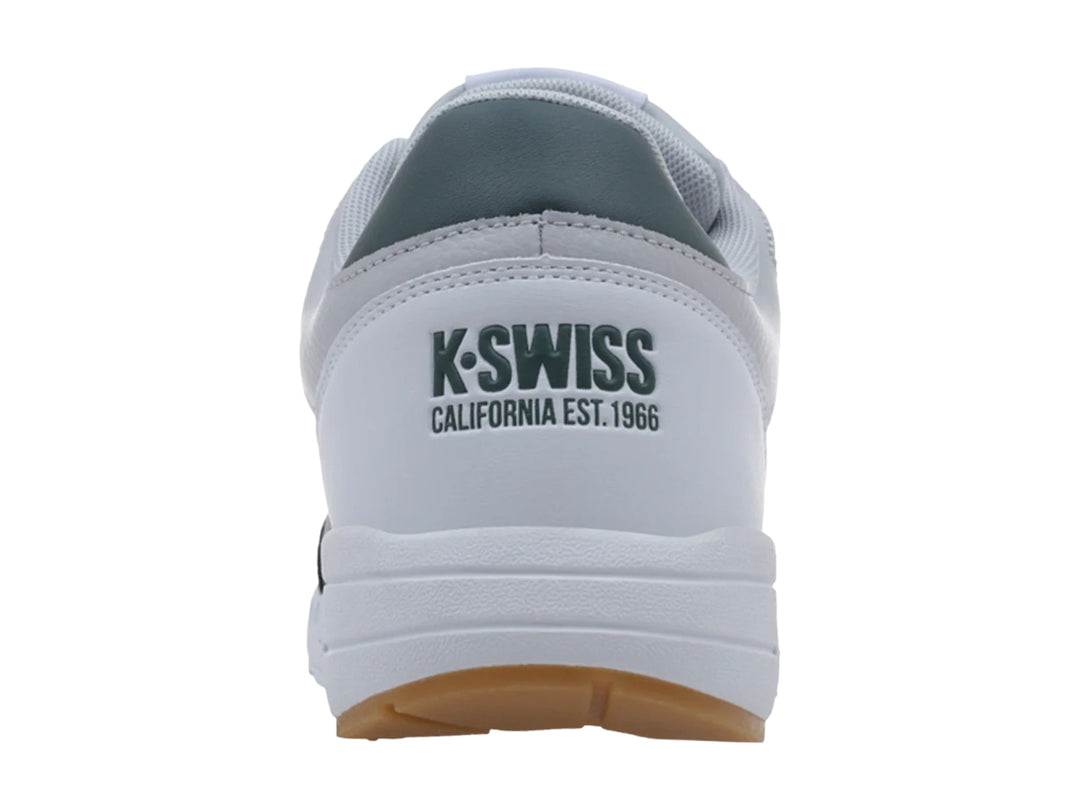 Tenis K-Swiss Maxwell en colores blanco, gris y verde con suela marrón y amortiguación visible.