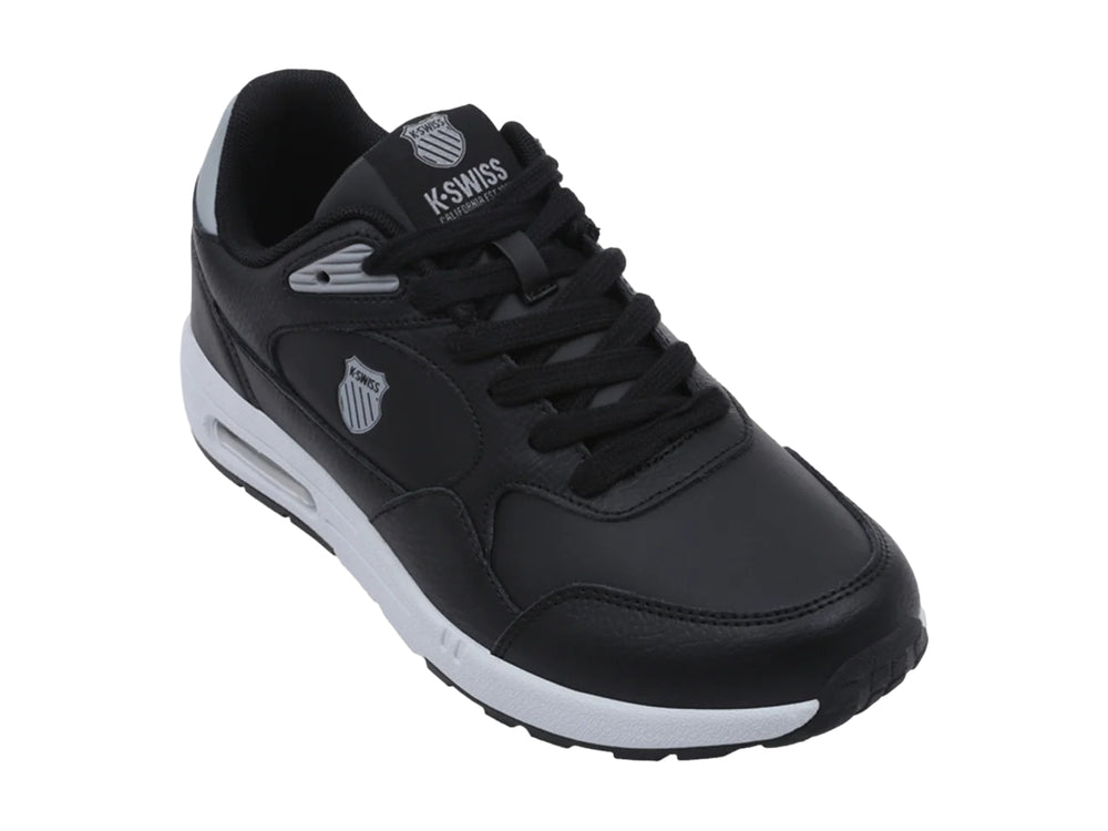 Tenis K-Swiss Maxwell en color negro con suela blanca y detalles en gris.