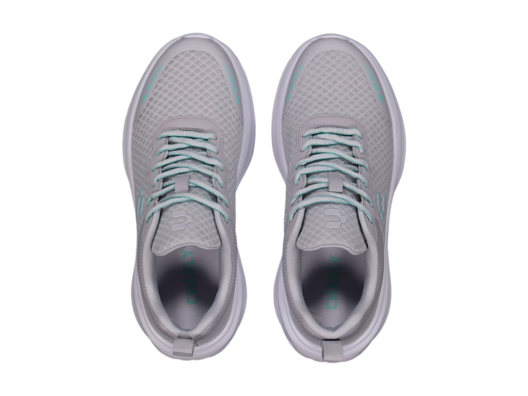 Tenis deportivos Charly color gris con suela blanca y detalles en color aqua.